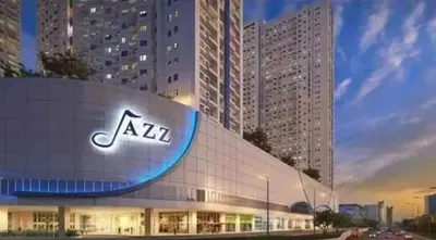a building with a sign on the side of it at Family Suites- Self Service Condo Unit in Jazz Residences Makati in Manila