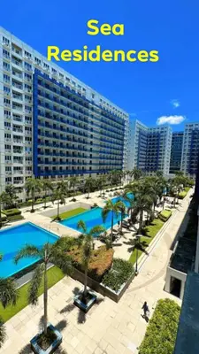 a view of a large apartment building with a swimming pool at Sea Residences 2 BR by TVANS in Manila