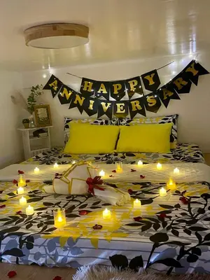 a bed with a happy anniversary sign and lights on it at Binangonan Primes Tiny Home with FREE breakfast and Plunge Pool in Binangonan
