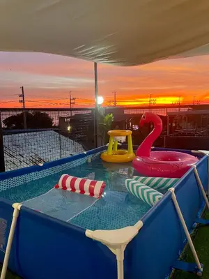 a swimming pool with a play equipment in at Binangonan Primes Tiny Home with FREE breakfast and Plunge Pool in Binangonan