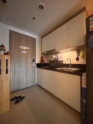 a kitchen with a sink and a sliding door at S Residences, Tower-3 in Manila