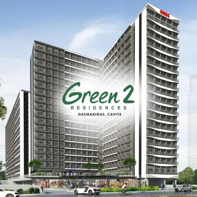 a large building with a green headquarters sign on it at HOMELY Green 2 Residences near DLSUHSI in Dasmariñas