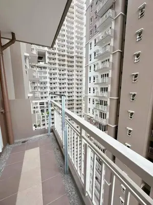 a balcony with a view of tall buildings at Tan condo city view 01 in Manila