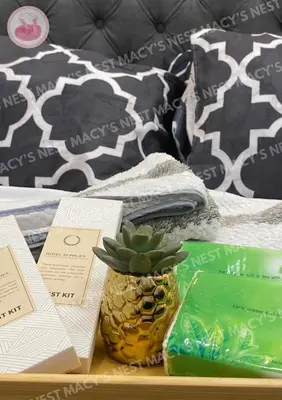 a pineapple sitting on a table next to a bed at Macy's Nest - Shore 2 Tower 1 in Manila