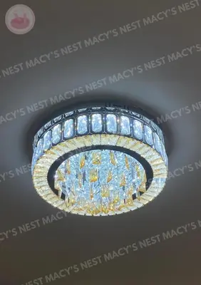 a chandelier is hanging from a ceiling at Macy's Nest - Shore 2 Tower 1 in Manila
