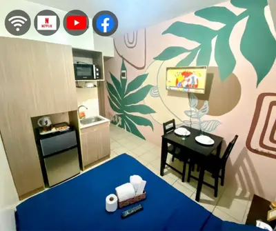 a small kitchen with a table and a dining room at Studio in the Metro I Near MRT I WiFi in Manila