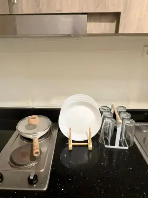 a frying pan sitting on top of a stove at Cozy 1 BR in EDSA Mandaluyong in Manila