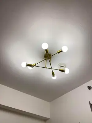 a ceiling fan with lights on a ceiling at Cozy 1 BR in EDSA Mandaluyong in Manila