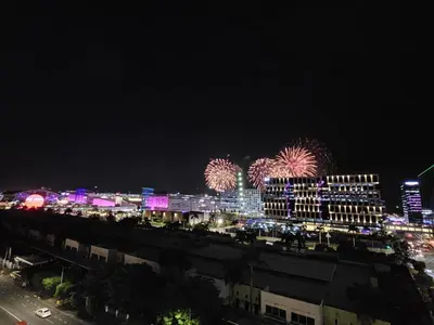 a city with fireworks in the sky at night at shore residences 1 -City Spark staycation in Manila