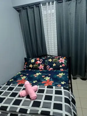 a childs bed with a pink pair of shoes on it at Berto's Staycation Long Term and Short Term in Manila