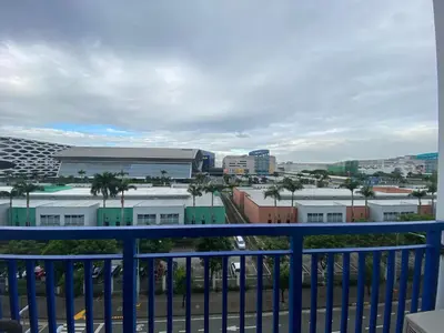 a view of a city from a balcony at Sea Crib in Manila