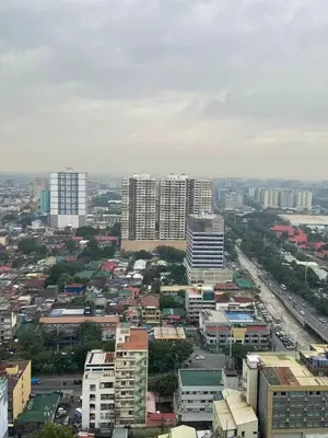 an aerial view of a city with tall buildings at FX Condotel 3322 in Manila