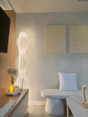 a living room with a chair and a sink at 2BR - Azure Staycation Parañaque in Manila