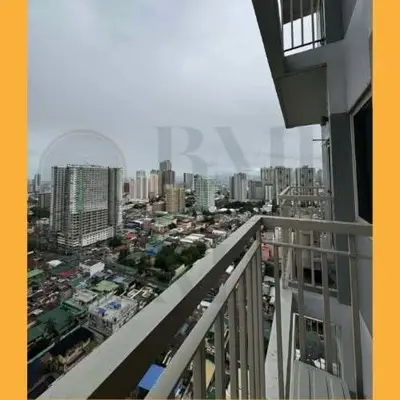 a view of a city from a balcony of a building at Staycation BMR Mnl at Coast Residences in Manila