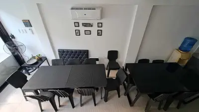 a dining room with a black table and chairs at VIEWDECK PRIVATE PooL in Taytay