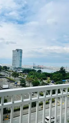 a view of a city from a balcony of a building at Namrata staycation in Manila