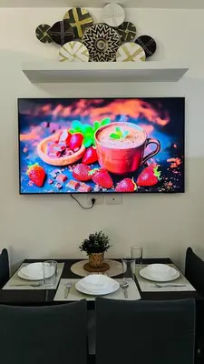 a painting of a red cup on a wall at Namrata staycation in Manila