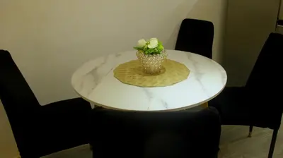 a white marble table with a vase of flowers on it at Phoenix Bliss - Amber in General Trias