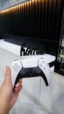 a person holding a video game remote control at Shore 3 - 1BR Scandi-Industrial Condo Suite by The Bay in Manila