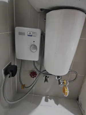 a toilet in a bathroom with a water tank at Unit 14E Tower D, 1BR Unit- Manhattan Heights Cubao in Manila