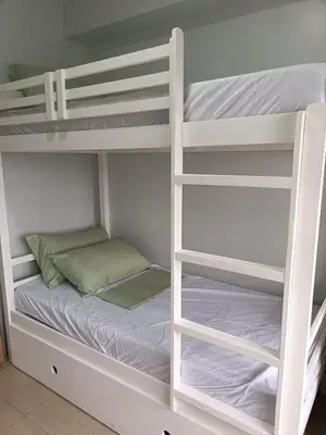 a couple of bunk beds in a room at Lyleis' Getaway in Manila