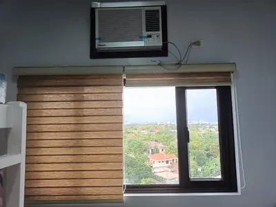 a window with a microwave on top of it at Lyleis' Getaway in Manila