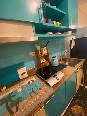 a toy kitchen with a sink and a stove at The Teal Deal in Manila
