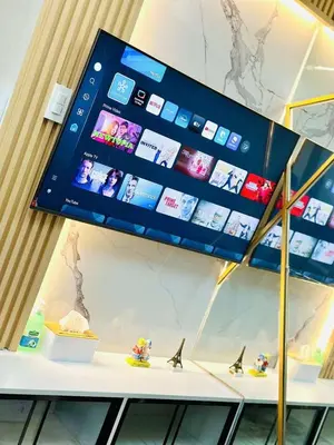 a display case with a tablet on a table at Royal Fame Residency in Manila