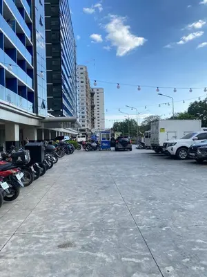 a parking lot with a lot of motorcycles and cars at Shore 3 - Unit Chloe - Brand New and Relaxing 1BR in Manila