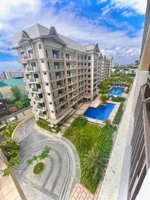 an aerial view of a building with a swimming pool at Calathea Luxe Atrium Suite in Manila