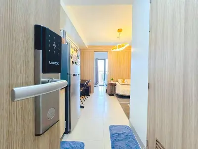 a room with a hallway with a refrigerator and a living room at shore 2 residences tower 2 16fl in Manila