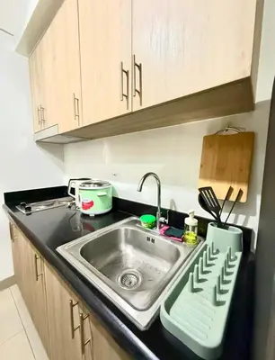 a kitchen counter with a sink in a kitchen at shore 2 residences tower 2 16fl in Manila