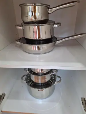 two pots sitting on top of a shelf at Luxury Coastal Suite, Grand Canal view in Manila