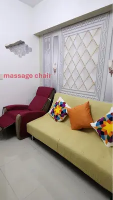 a living room with a couch and a chair at SMDC Light Residences Condominium in Manila