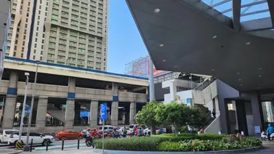 a building with cars parked in a parking lot at SMDC Light Residences Condominium in Manila