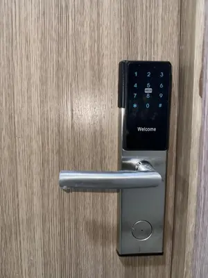 a door opener with a smart phone in it at Mall of Asia Vermilion Grand Suite in Manila