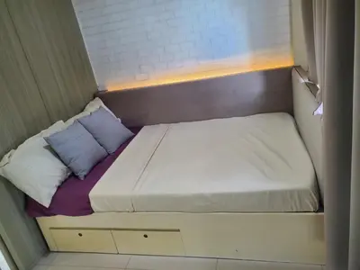 a small bed in a small room at La Luz 0835 Smdc Breeze in Manila