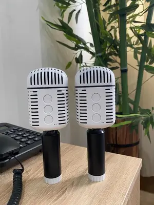 two microphones sitting on a desk next to a keyboard at Casa Maria Staycation SMDC Hope Residences in Trece Martires