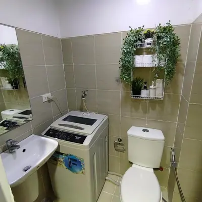 a small bathroom with a toilet and a sink at Mk Luxury Staycation in Manila