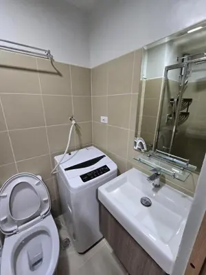 a bathroom with a toilet and a sink at Shore 3 Residences tower 3 in Manila