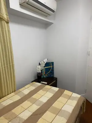 a bedroom with a bed in a room at ECN Suite and Staycation in Manila