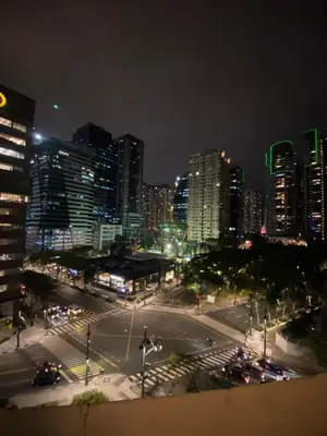 a city skyline at night with a busy intersection at ECN Suite and Staycation in Manila