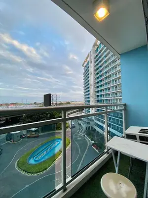 a balcony with a view of a building at Yumi Azure Staycation in Manila