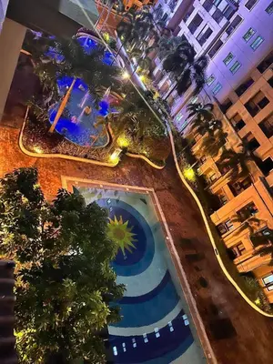 an overhead view of a swimming pool in a hotel at Pinecrest Residential Condominium Newport Pasay City in Manila