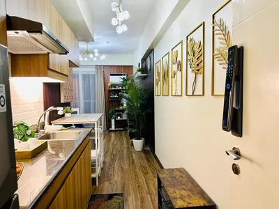a kitchen with a sink and a counter at Cozy Escape Satori Residences Santolan in Manila
