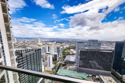 a view of a city from a skyscraper at Travellers Haven 3br BGC, Bathtub, XBOX, 200mbps in Manila
