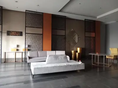 a living room with a bed and a couch at Radiance manila bay in Manila