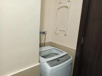 a small bathroom with a toilet in the corner at Radiance manila bay in Manila