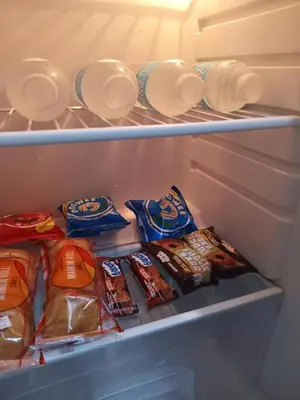 an open refrigerator withrozen food inside of it at Radiance manila bay in Manila