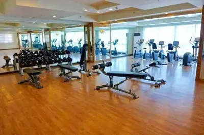 a gym with a bunch of exercise bikes in it at Flair Towers Urban Resort Staycations in Manila